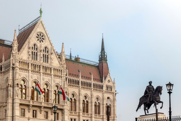 Naklejka na ściany i meble View of Hungarian Parliament building and statue of Count Gyula Andrassy