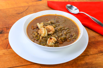 Shrimp Gumbo on Rustic Wooden Table with Red Napkin