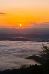 Obraz premium sunset overlooking mountains with Mist