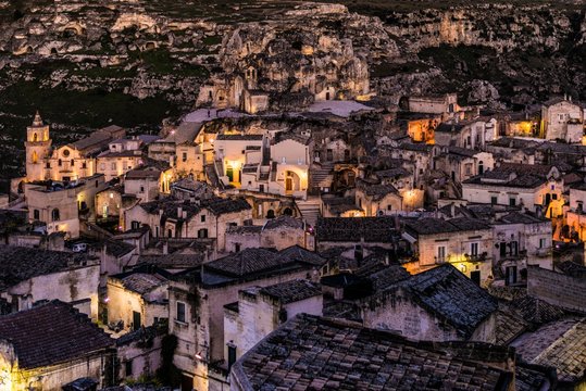 Sasso Caveoso district with San Pietro Caveoso church and Santa Maria de Idris cave church at night, Matera, Basilicata, Italy, Europe