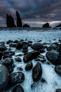 Lava coast, Baia do Cedros with rock needles in the sea, dramatic clouds, Cedros, Flores Island, Azores, Portugal, Europe