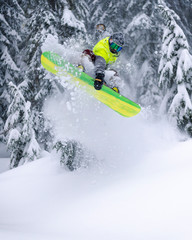 Extreme Backcountry Snowboard Jump Board Grab in Powder Spray