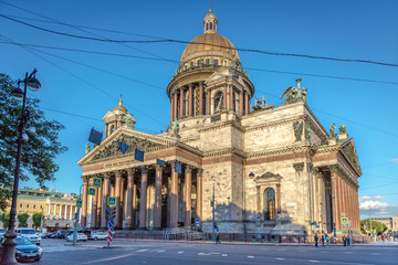 Fototapeta na wymiar Saint Petersburg, Russia - June 8th 2018 - The Saint Isaac's Cathedral in a late afternoon with cable lines crossing in front of it in Russia