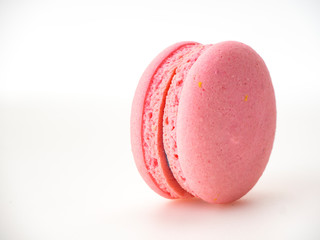 Pink macaroon on white background
