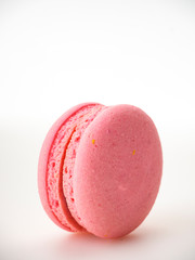 Pink macaroon on white background