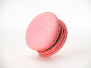 Pink macaroon on white background