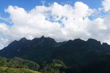 Beautiful landscape on mountain with sky and cloud, peace and relaxation, Beautiful nature to make our mind calm, Mist and green mountains in the background, copy space, Doi Chiang Dao at Thailand