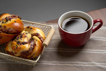 Cups of Black coffee with danish bread
