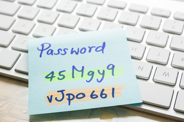 Login password on paper note and keyboard.