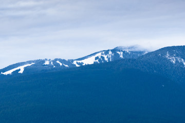 Fototapeta na wymiar View on Grouse Mountain from Burnaby Mountain, BC