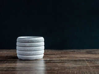 Modern concrete planter on wooden table