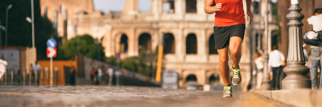 Runner running in Rome city street at marathon run. Banner panorama of athlete's legs and running shoes in outdoor background.