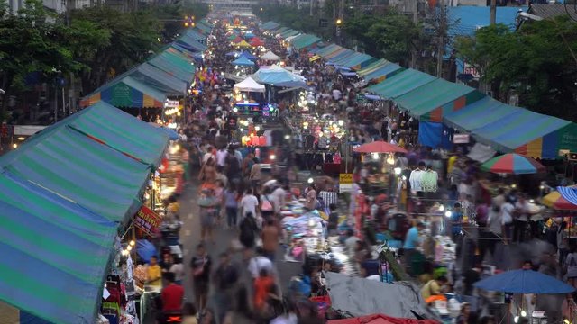 Crowd moving at local market on street, a shopping street festival in Bangkok, Thailand  time lapse