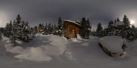 Panorama house chalet during a snowfall in the trees winter forest at night in the moonlight....