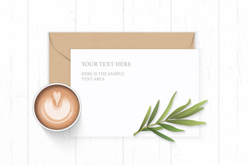 Flat lay top view elegant white composition letter paper kraft envelope coffee and tarragon leaf on wooden background