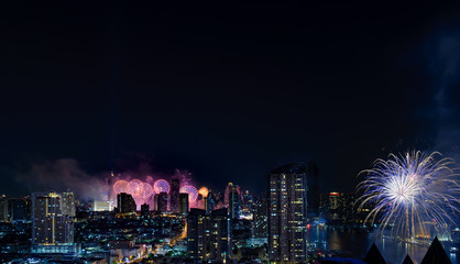 Fototapeta na wymiar Celebration fireworks in the city at night time. landscape of Bangkok City. Thailand.