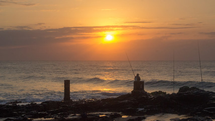 sunrise with fisherman and post 