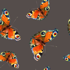 Seamless pattern of butterflies painted in watercolor.