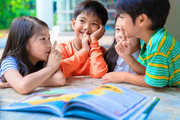 Asian Little Children Reading Book Cheerful