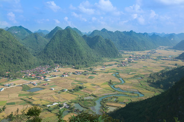 Amazing rice fields in valley with karst mountains and limestone peaks in Bac Son, Vietnam