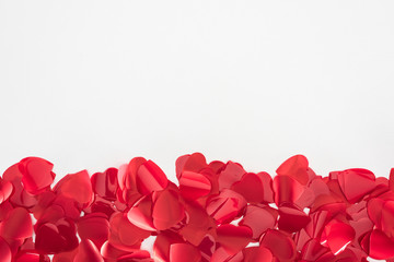 close-up view of beautiful red heart shaped petals on grey background, valentines day concept