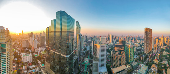 Panorama sunset Bangkok city downtown with modern building and transport Silom Sathorn district, Thailand
