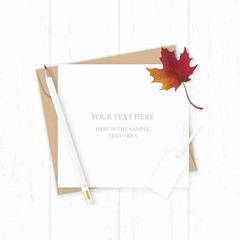 Flat lay top view elegant white composition letter kraft paper envelope nature autumn maple leaf pencil and tag on wooden background