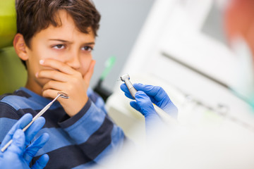 Little boy is afraid of dentist. 