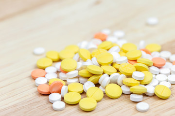 Colorful pills and drugs in close up. Assorted pills and drugs in medicine. Opioid and prescription medication addiction epidemic. Drugs of various kinds.
