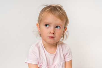 Naklejka premium Little baby with sad expression in face