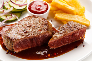 Grilled beefsteak with french fries on white background