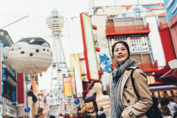 female cheerfully standing on teeming street © PR Image Factory