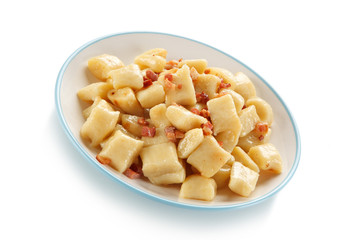 Potato noodles - dumplings on white background