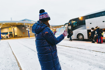 Travel lifestyle woman traveler bus terminal sweden looking map