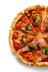 Pizza with bacon and vegetables on cutting board on white background