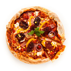 Pizza with ham, corn, mushrooms and dried tomatoes on white background
