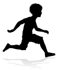 A high quality detailed kid or child in silhouette playing and having fun