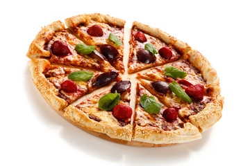 Pizza with plums and strawberries on white background
