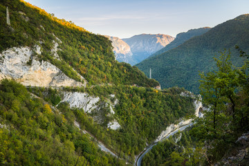 Beautiful green ravine in mountains with Hairpin turn road and tunnel