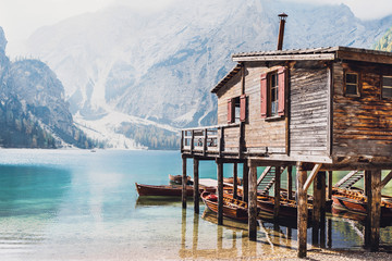 Vacations in Italian Alps. Beautiful Braies lake (Lago di Braies). South Tyrol, Dolomites, Italy, Europe - obrazy, fototapety, plakaty