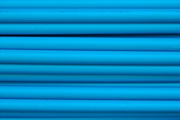 Blue PVC drainage pipe on the side of the pile together to prepare the assembly, moving, selling,...