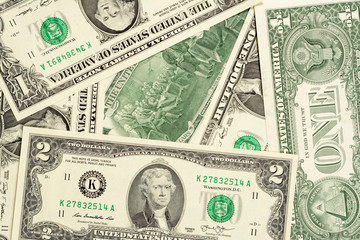 One and two dollars banknotes, front and back background. High resolution photo close-up macro.