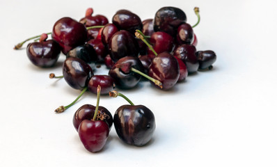 Cherries surrounded by white background