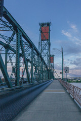 Hawthorne Bridge over Willamette River at sunset and its vertical lifts in downtown Portland, USA