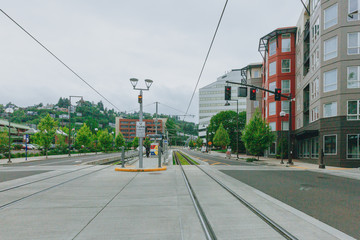 Fototapeta na wymiar Tram tracks and buildings in downtown Portland, USA
