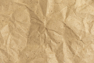 Background of crumpled wrapping paper. Rumpled paper texture