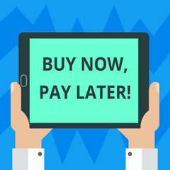 Text sign showing Buy Now Pay Later. Conceptual photo Credit to purchase things payment time after buying Hu analysis Hand Holding Blank Screen Tablet Smartphone Display Unit photo