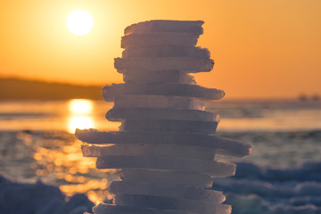 pyramid of pieces of ice at sunset