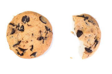 A broken chocolate cookie isolated at the white background. Sweet buns. Homemade pastry. A view from above.