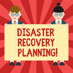 Conceptual hand writing showing Disaster Recovery Planning. Business photo showcasing procedures to recover and protect a business Male and Female in Uniform Holding Placard Banner Text Space